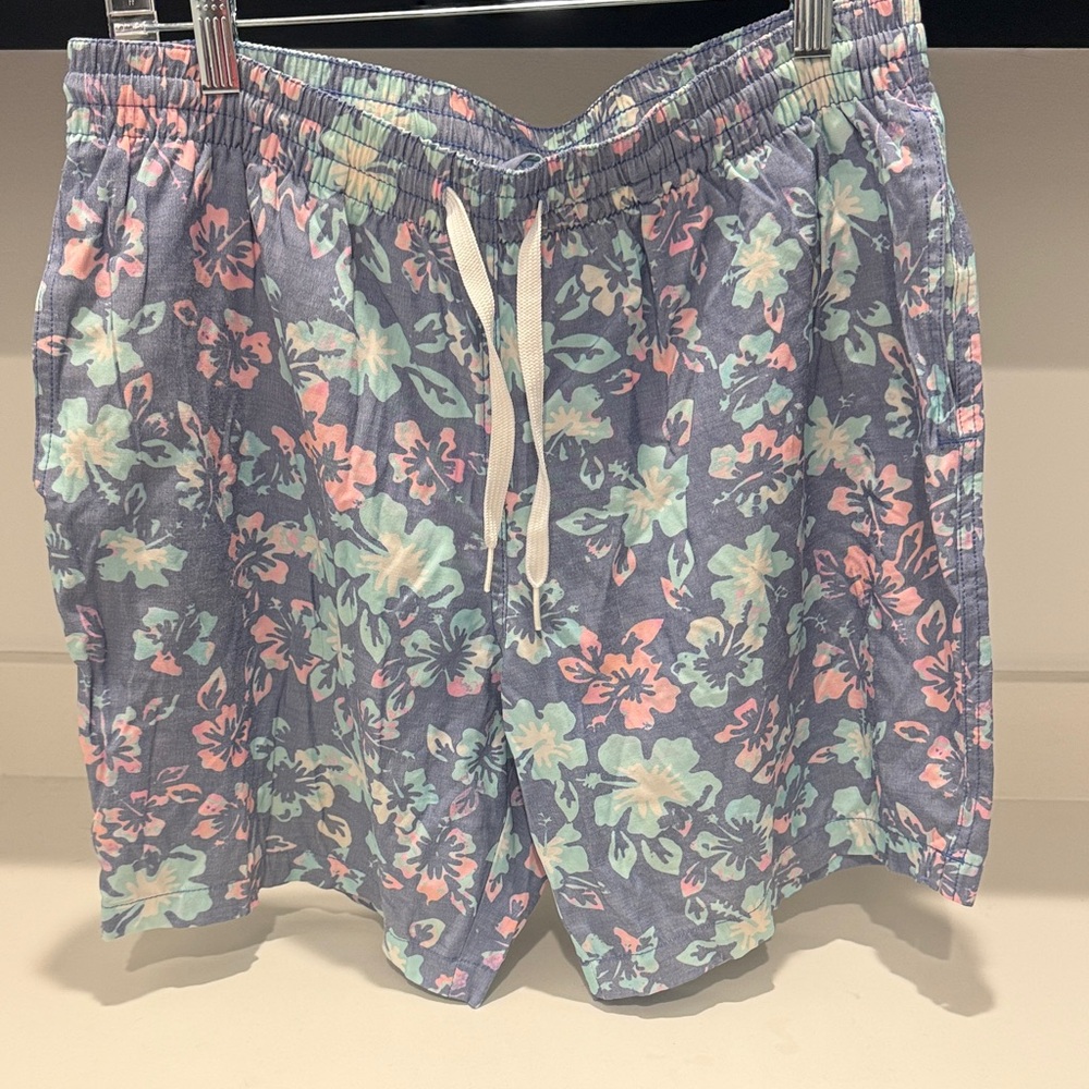 Chubbies men's swim trunks with blue and multi-color Hawaiian Pattern. Size M